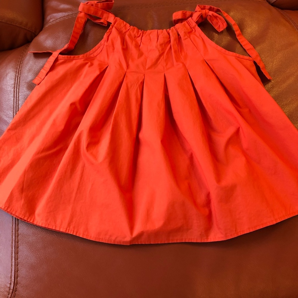 Super cute orange top from Anthropologie